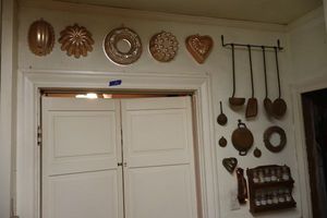 lot 195 image: Jello molds, vintage copper utensils, and spice rack