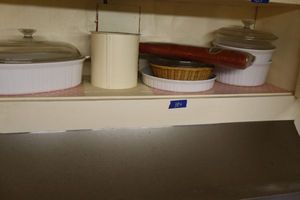 lot 184 image: French white baking dishes with red table cloth