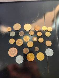 lot 90 image: A selection of collectible tokens, double sided coins, casino chips, peep shoe, New York fare token and more