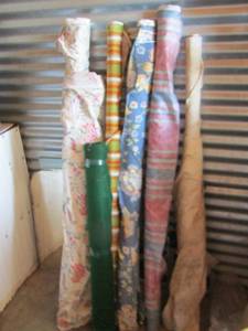 lot 114 image: various rolls of fabric