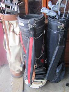 lot 201 image: 2 bags with various golf clubs, 1 empty golf bag