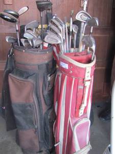 lot 203 image: pink golf bag and brown golf bag with various brand and size golf clubs