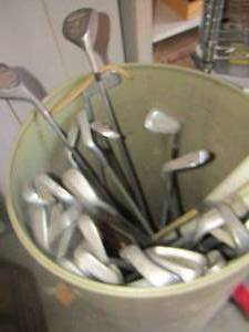 lot 193 image: tub of various golf clubs