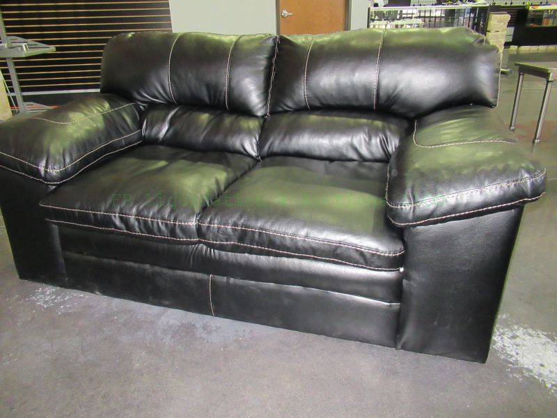 lot 11 image: Bonded leather loveseat