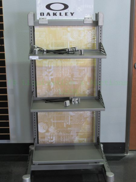 lot 16 image: Oakley commercial rolling display rack