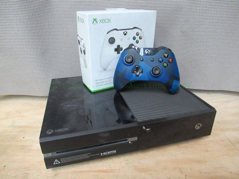 lot 311 image: Xbox console and game controllers