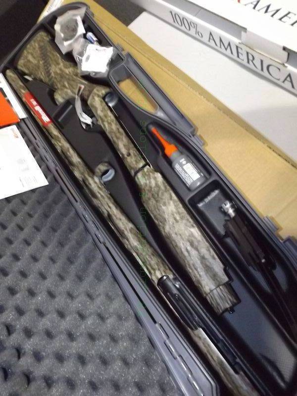 lot 834 image: NEW in box Benelli Super Black Eagle II 28 12ga Mossy Oak Bottomland Shotgun