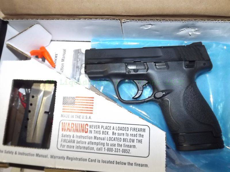 lot 889 image: NEW in box Smith & Wesson M & P shield 9mm automatic pistol with accessories