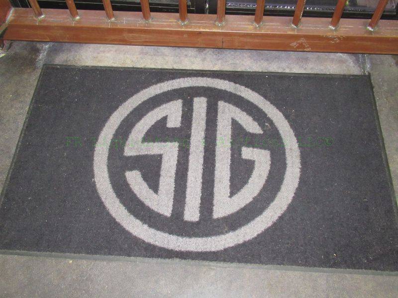 lot 522 image: Sig Sauer logo entry rug