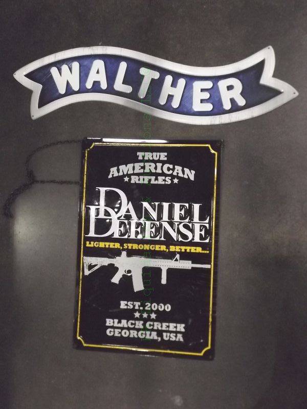lot 820 image: Walther & Daniel Defense tin signs