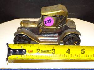 lot 278 image: 1915 CHEVY BANTHRICO BRASSCOPPER COIN BANK WITH BANK ADVERTISEMENT - ESSEX BANK