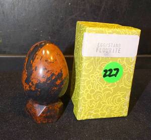 lot 227 image: Mahogany Obsidian Polished Egg with Wood Stand  approx 2.5 x 2