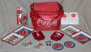 lot 114 image: Mix of Coca-Cola items like lunch bag 2 bottle openers , coasters, koozies and more see pictures