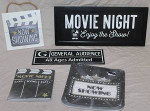 lot 115 image: Movie wall pictures and paper plates and a pack of napkins