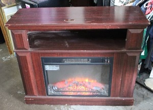 lot 1 image: brown electric fireplace heatertv stand tested and worked when posted heat blows from the front