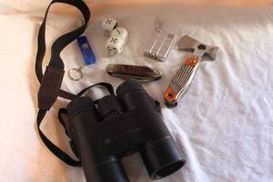 lot 20 image: Leupold binoculars made in the Philippines pocket knives and a few collectible lighters