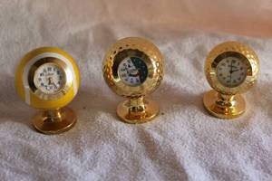lot 27 image: small sports ball style desk clocks
