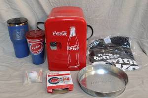 lot 49 image: Coke-Cola lot 6-can refrigeratorcoasterscups with lidsgolf ball and teesXXL t-shirt things go better with Cokesmall metal tray
