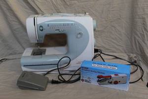 lot 62 image: Bernette 80e sewing machine and a handheld sewing machine