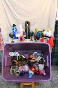 lot 139 image: tote full of decorated wine bottles and glasses and much more