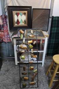 lot 188 image: Pictures the tall one is all metal then one is footprints in the Sand and 3 others