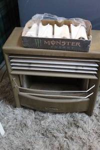 lot 205 image: vintage Dearborn gas heater.