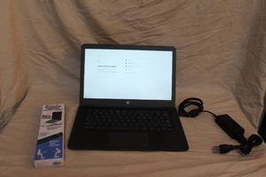 lot 223 image: HP Chrome with charger and adjustable foldable laptop stand
