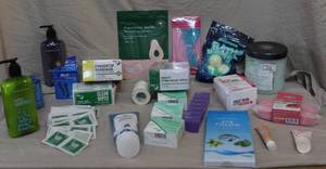 lot 281 image: Lot of bathroom things and first aid items like 10 unopened boxes of fingertip bandages and 10 unopened boxes of insect sting relief wipes  and so much more see pictures