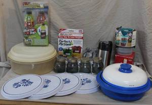 lot 287 image: vintage CorningWare items and other kitchen gadgets. Like coffee grinder and coasters and much more see pictures