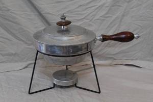 lot 289 image: vintage B. W. Buenilum hammered aluminum chafing dish or fondue pot with a wooden handle and stand.