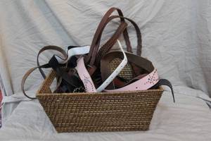 lot 297 image: Wicker basket full of belts