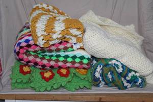 lot 316 image: collection of assorted handmade crochet blankets and afghans.