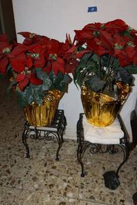 lot 14 image: Wire plant stands with artificial poinsettias