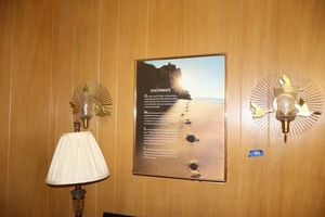 lot 44 image: Home decor table lamp, pair of vintage wall sconces with Footprint poster