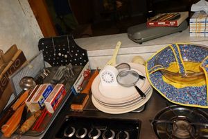 lot 65 image: Misc. kitchen items with grilling utensils