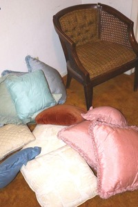 lot 97 image: Vintage cane and upholstered chair plus throw pillows