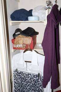 lot 107 image: Closet clothes and hangers as shown