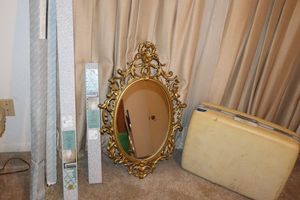 lot 112 image: Vintage oval wall mirror, vintage Samsonite suitcase, and curtain rods