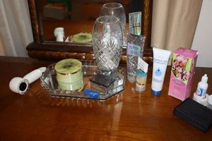 lot 115 image: Vanity tray with crystal vase and stone trinket boxes and more