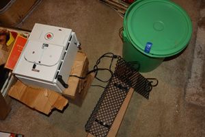 lot 122 image: Pair of metal shelves, vintage Keystone movie projector, and green bucket