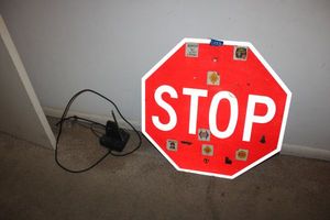 lot 153 image: Metal stop sign and antenna