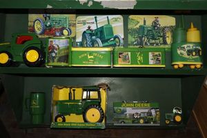 lot 8 image: John Deere collectibles with toy tractors