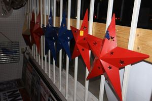 lot 15 image: Colored metal stars in red and blue plus Texas flag star