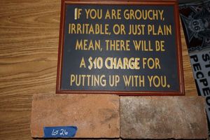 lot 26 image: Grouchy sign with two Texas engraved bricks