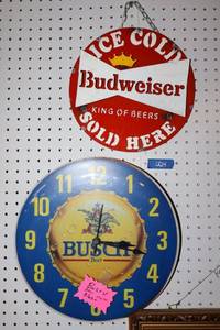 lot 24 image: Budweiser metal sign and Busch wall clock
