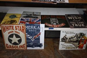 lot 30 image: Metal signs with cars and motorcycles