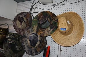 lot 36 image: Straw hat and camo hats