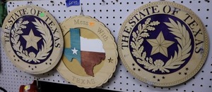 lot 47 image: Wooden Texas circle signs