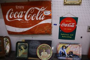 lot 56 image: Coca-Cola lot with vintage metal signs