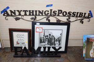 lot 91 image: Home dcor with metal Anything is possible sign